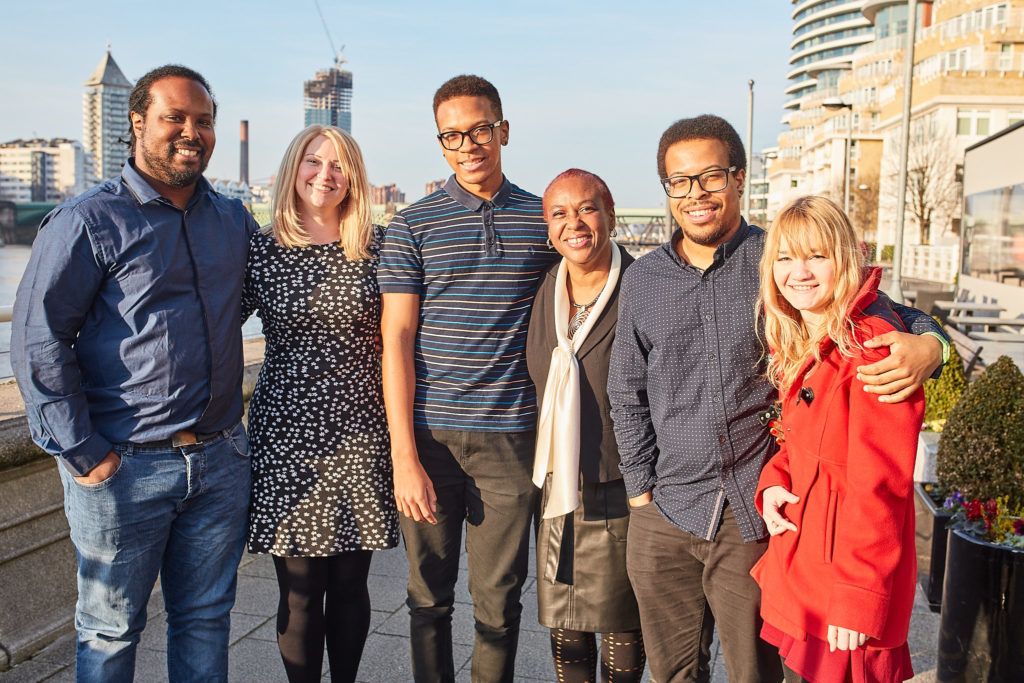 Family group photo on the terrace beside the Thames