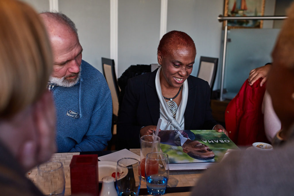 Guests reading a card at the table