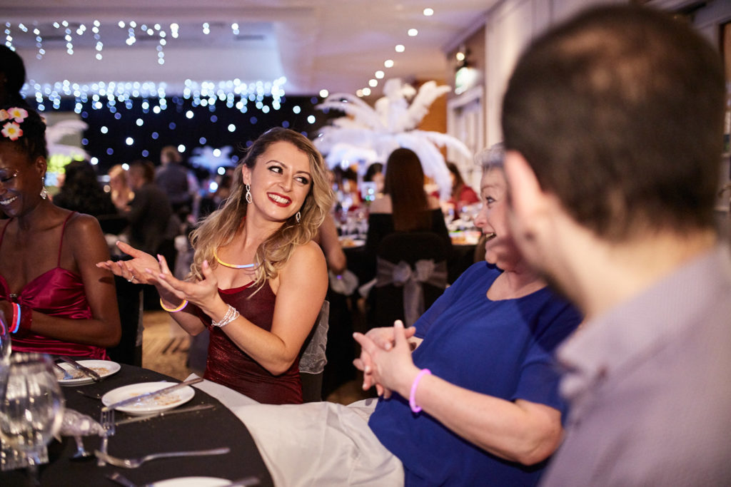 Guests laughing together at their table