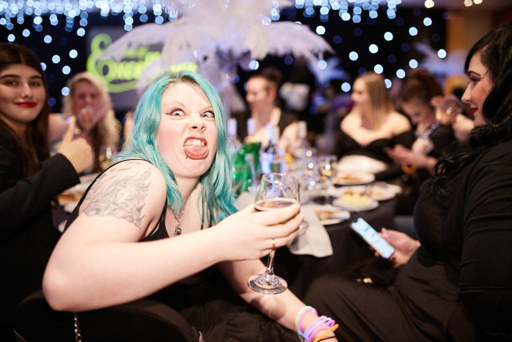 Guest with turquoise hair pulling a face at the camera
