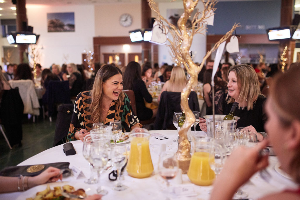 Guests chatting at their table during the awards dinner