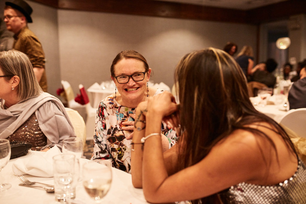 Guests chatting at the table during the awards dinner