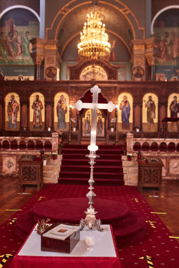 Ornate cross and baptism table in front of the icon screen at the Serbian Orthodox Church in west London