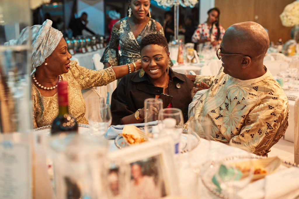 Party guests laughing together at the table
