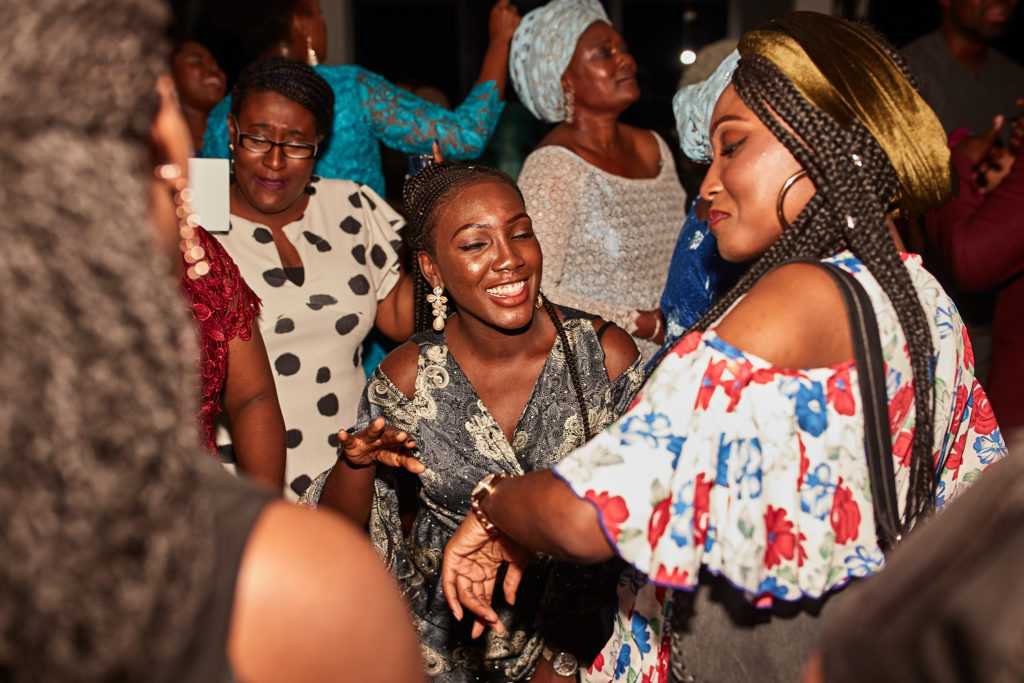 Guests laughing together on the dance floor