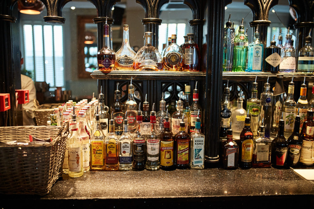 Shelves of spirits behind the bar at the Chapel Bar