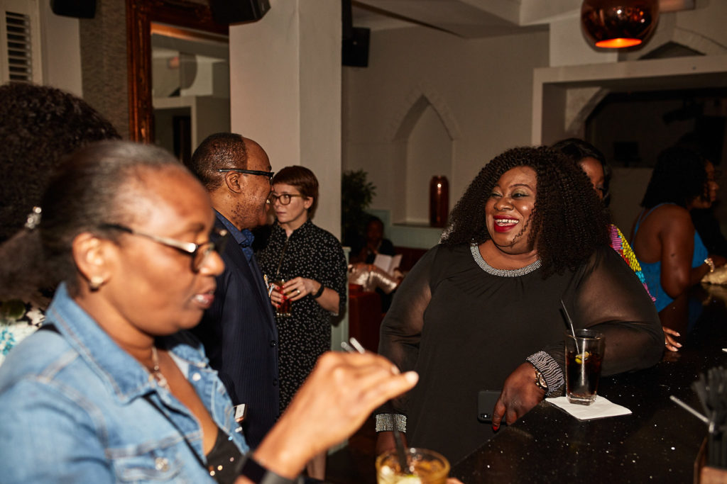 Guests talking together over drinks