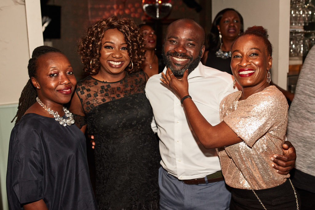 Birthday host posing with a group of friends