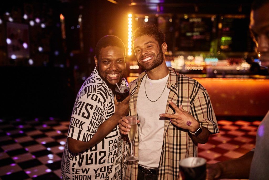 Two friends posing together at the club night