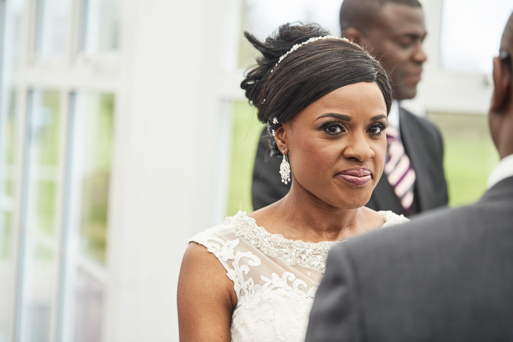 Bride smiling during the wedding ceremony