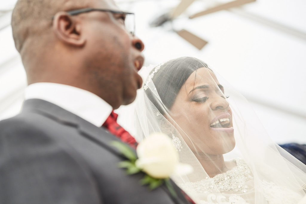 Bride and groom singing together during the ceremony