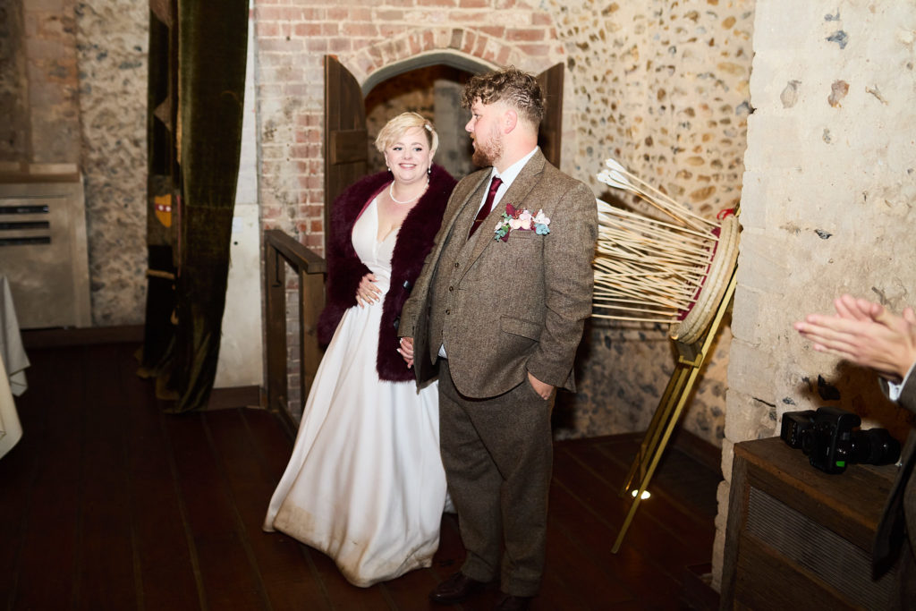 Bride and groom entering the hall for their wedding breakfast
