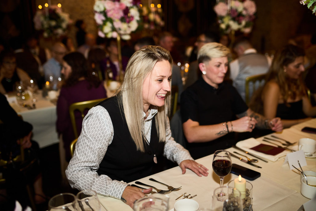 Wedding guests chatting at the table