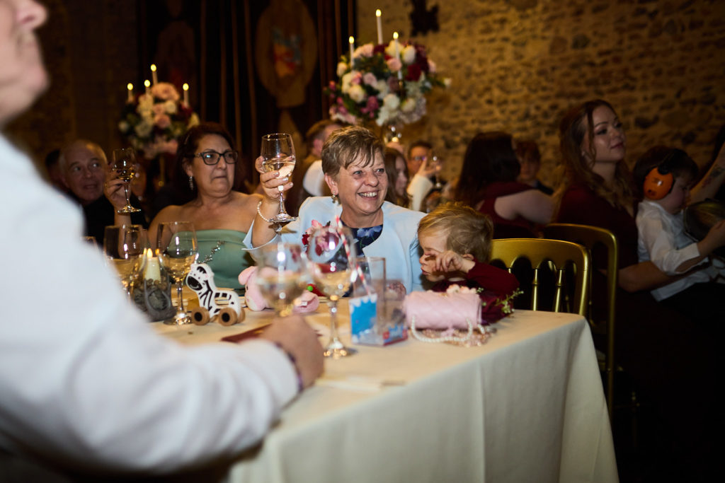 Wedding guests seated along a banquet table