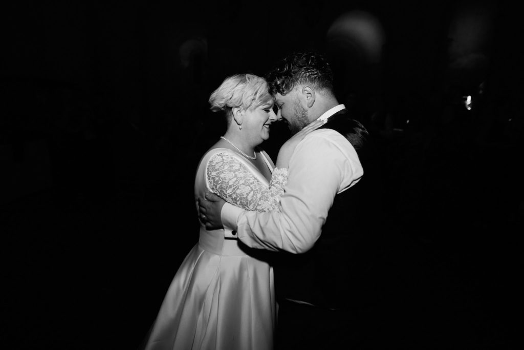 Black and white photo of the bride and groom's first dance