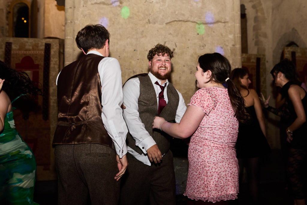 Wedding guests chatting on the dance floor