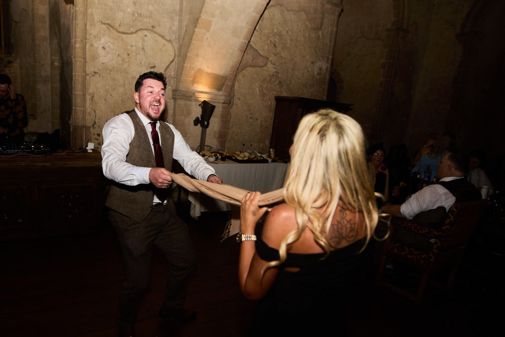 Wedding guests dancing hand in hand