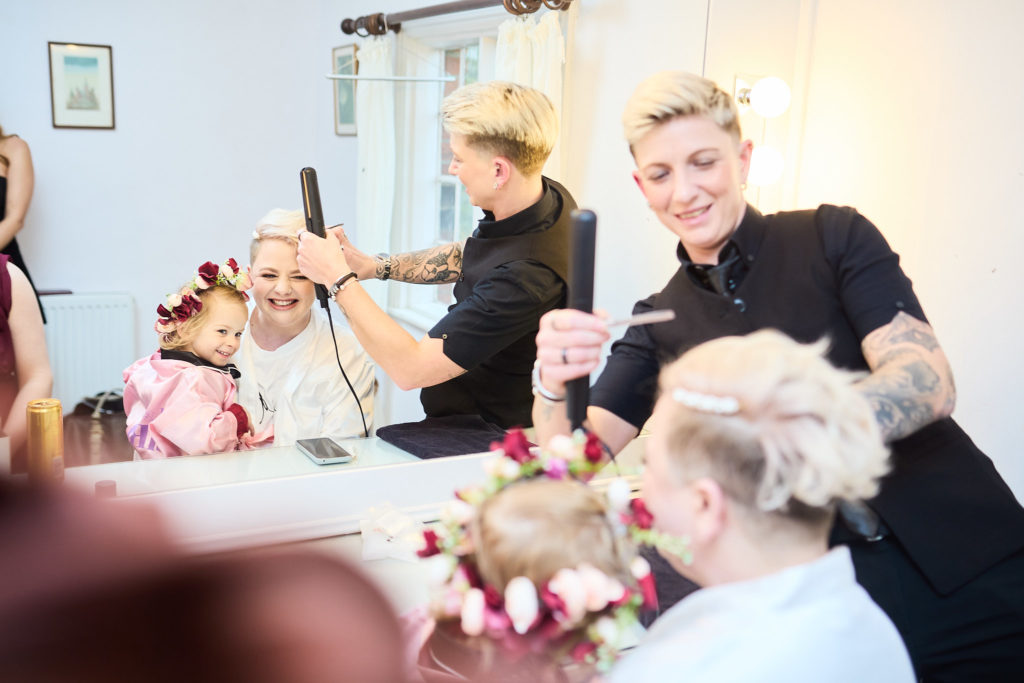 Bridal party having their hair and make-up done