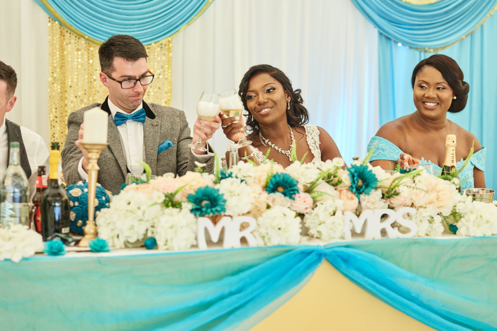 Bride laughing at the top table during the speeches
