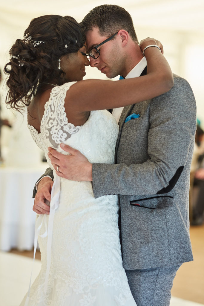 Bride and groom forehead to forehead during their first dance