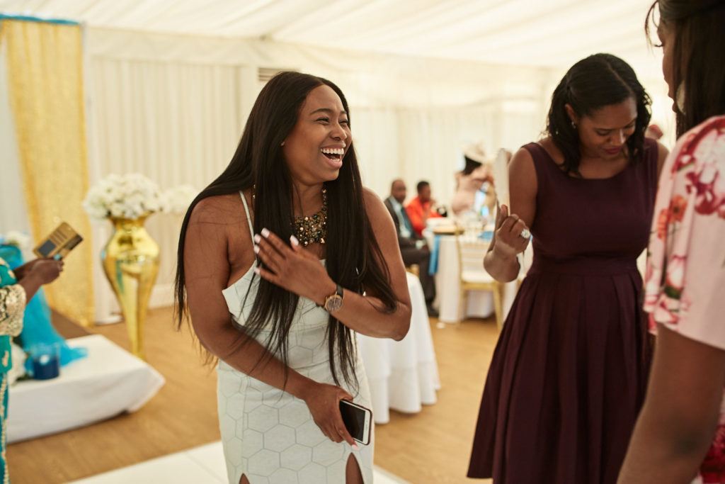 Wedding guests laughing on the dance floor