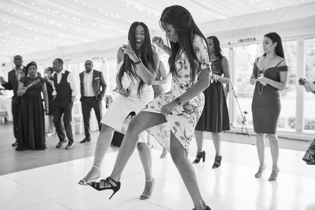 Black and white photo of guests dancing together