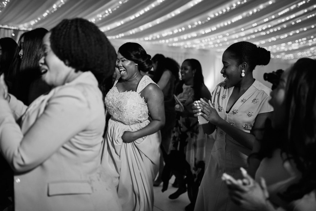 Black and white photo of guests dancing in the evening