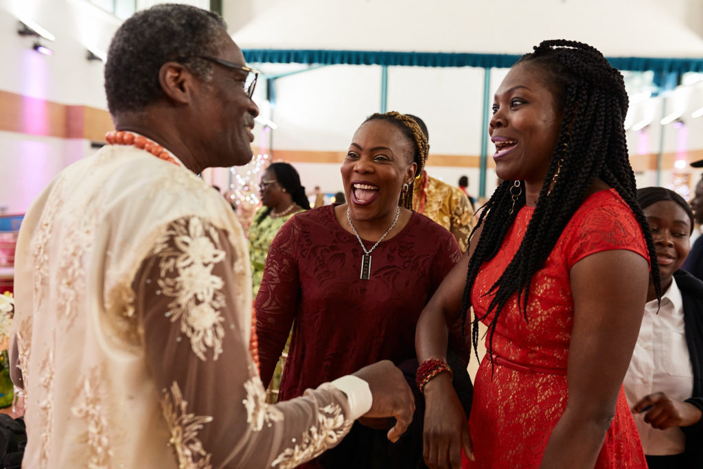 Wedding guests greeting each other in the hall