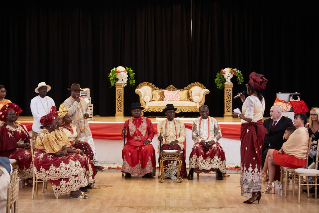 Family elders seated on stage during the traditional wedding ceremony
