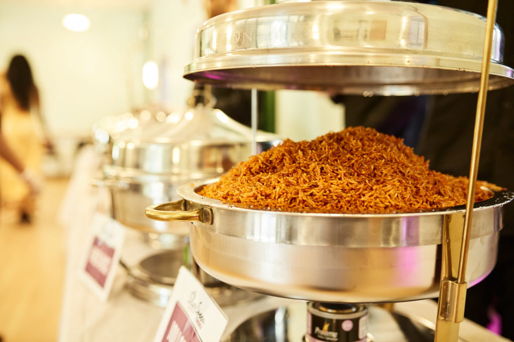 Jollof rice in a silver serving dish at the wedding buffet