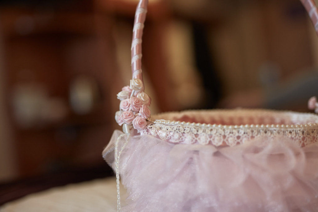 Pink tulle flower girl basket trimmed with pearls