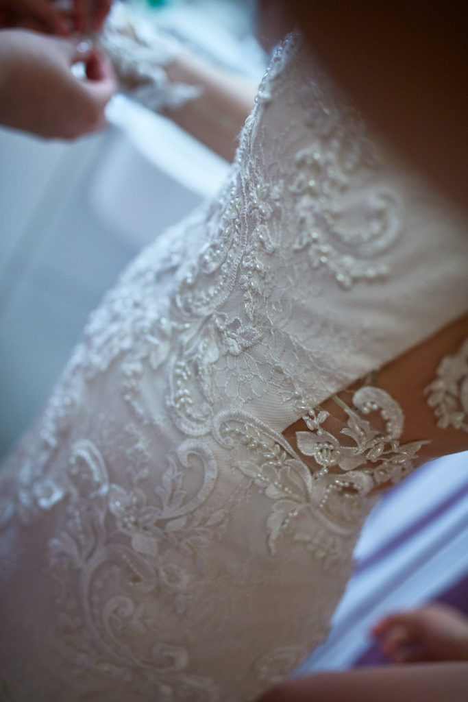 Close-up of the lace bodice of the wedding dress
