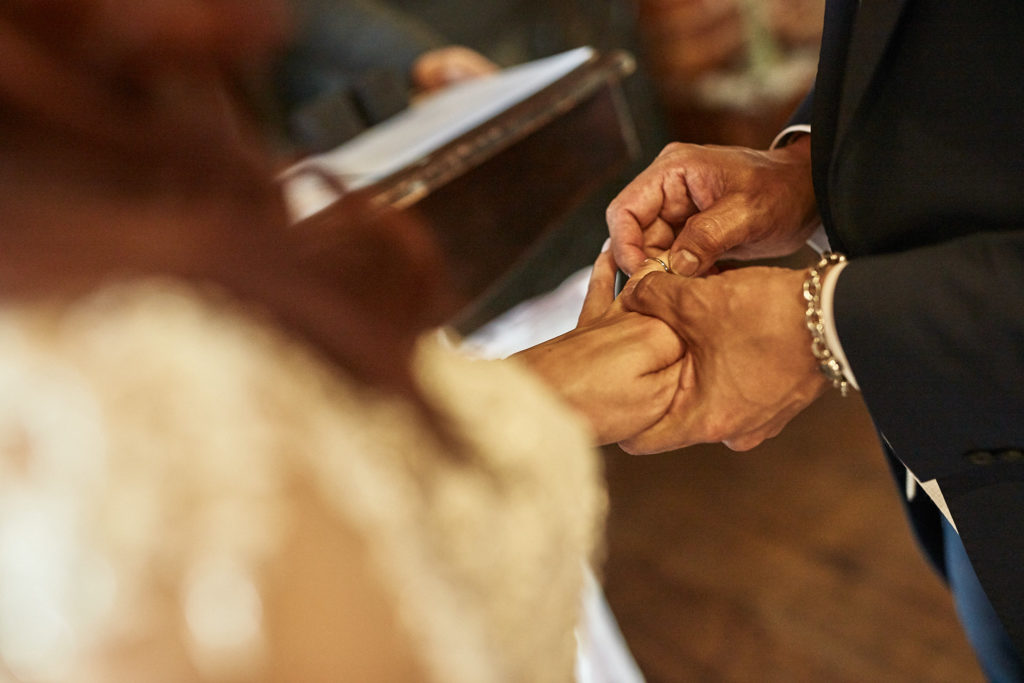 Close-up of the bride and groom exchanging rings