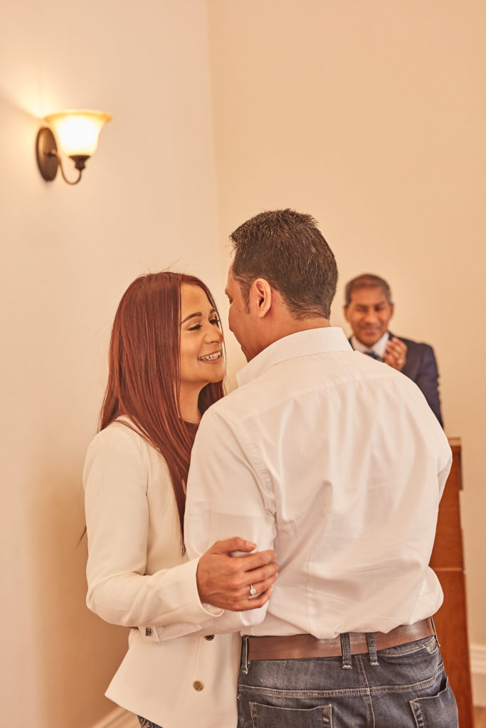 Bride and groom forehead to forehead at the end of the ceremony