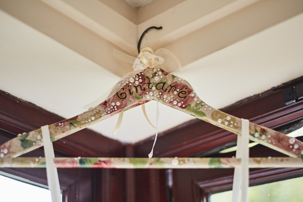 Floral fabric-covered coat hanger for the wedding dress