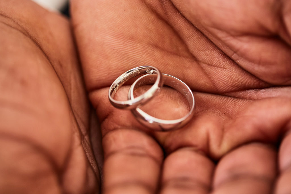 Wedding rings resting in the palm of a hand