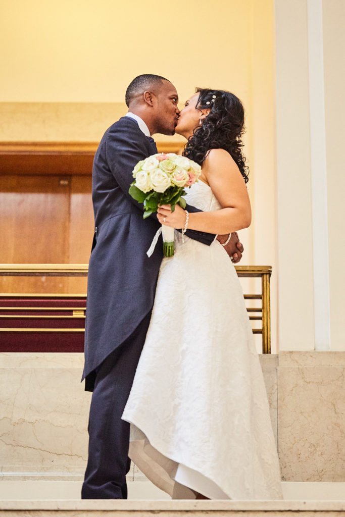 Bride and groom kissing after their wedding ceremony