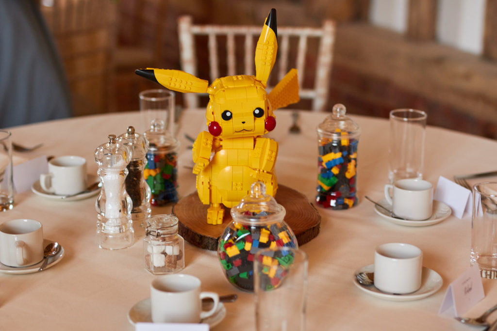 Pikachu model as a table centrepiece with jars of sweets at the wedding breakfast