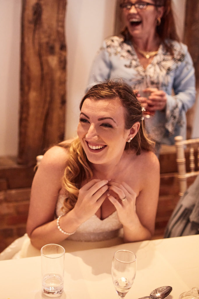 Bride laughing at the top table