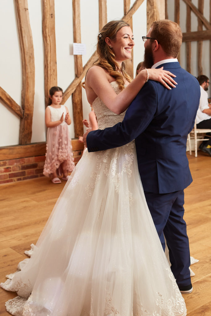 Bride and groom's first dance in the oak-framed barn at Villiers Barn