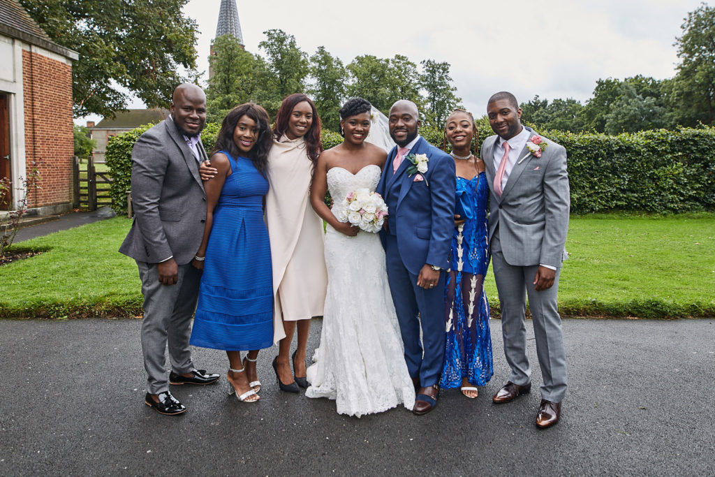 Bride and groom with family outside the church