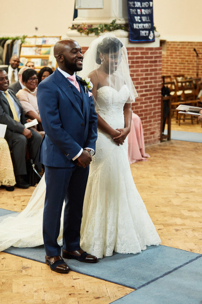 Bride and groom standing together during their church wedding
