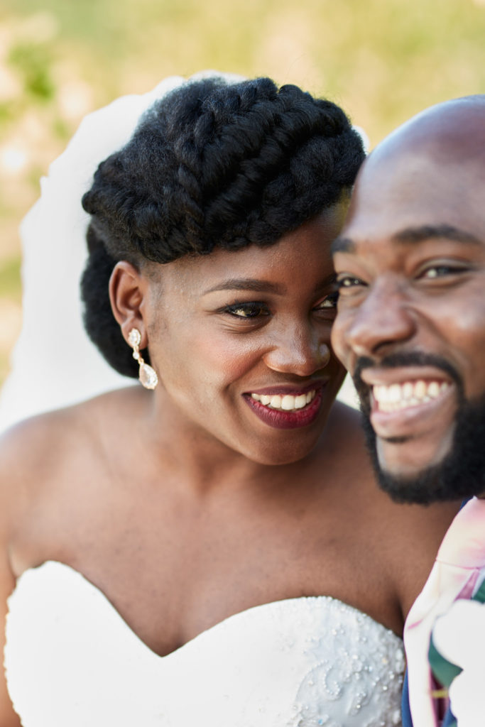 Close-up of the bride and groom laughing together