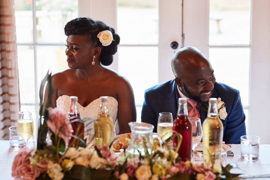 Bride and groom at the top table during the speeches