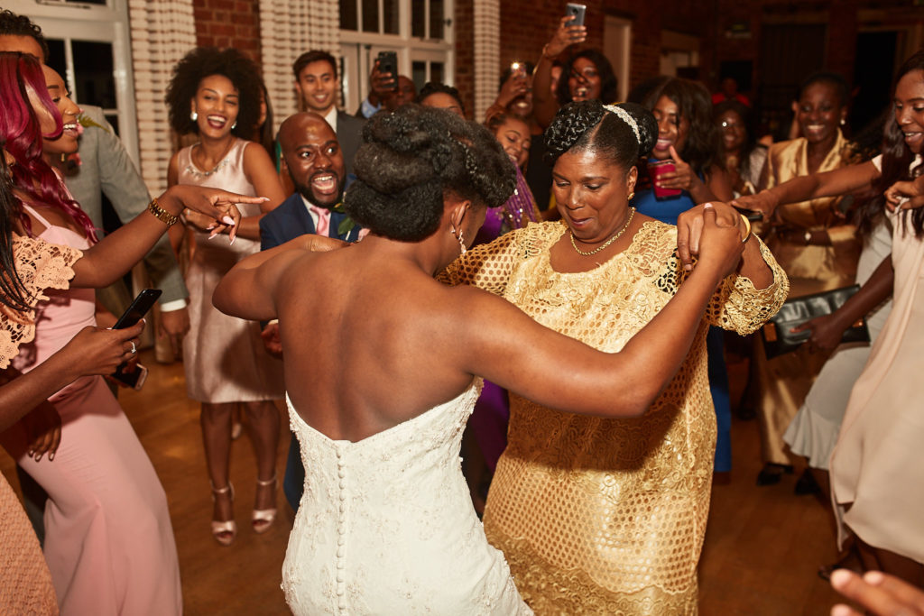 Bride dancing with guests at the evening reception