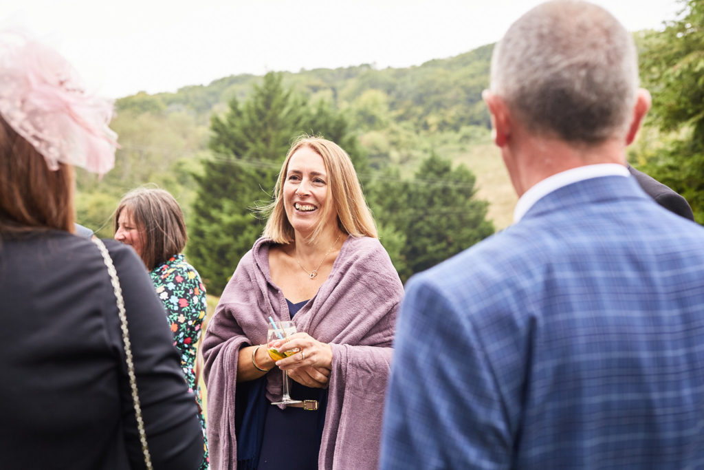 Wedding guests chatting outdoors