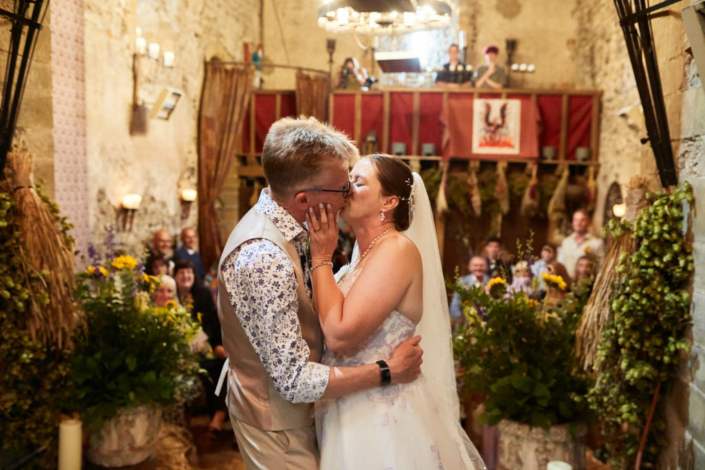 Bride and groom's first kiss in the church at Dode