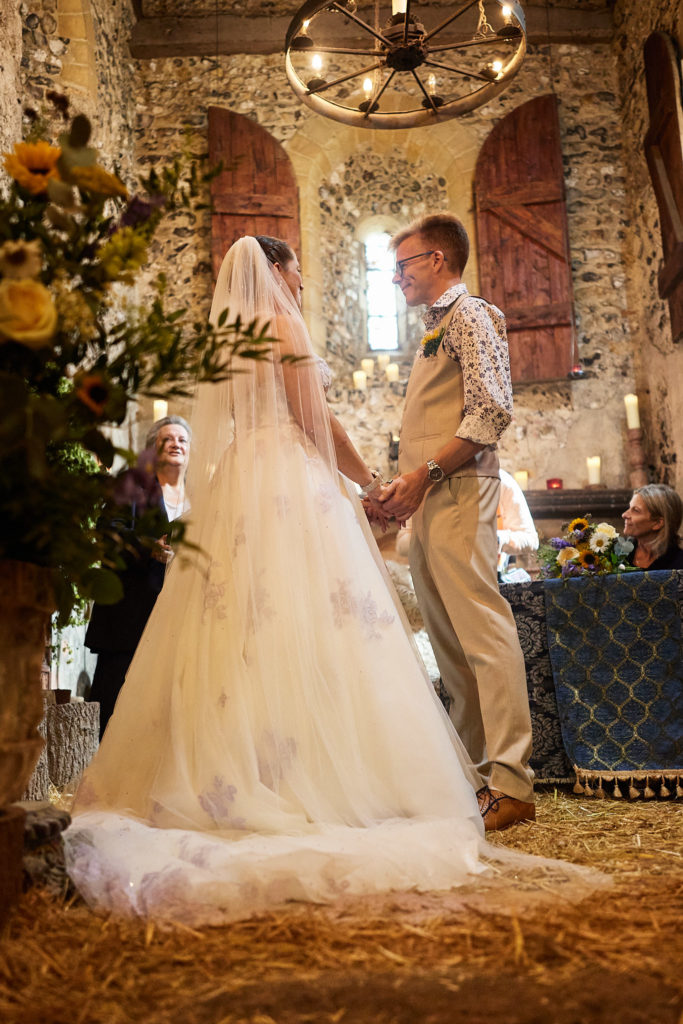 Bride and groom at the altar, seen from behind