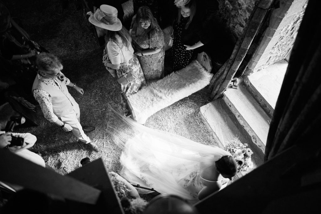 Black and white view from above of guests inside the church