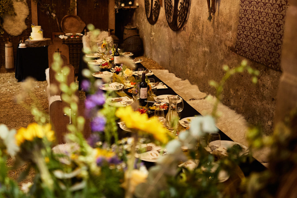 Banquet table inside the church with wildflowers in the foreground